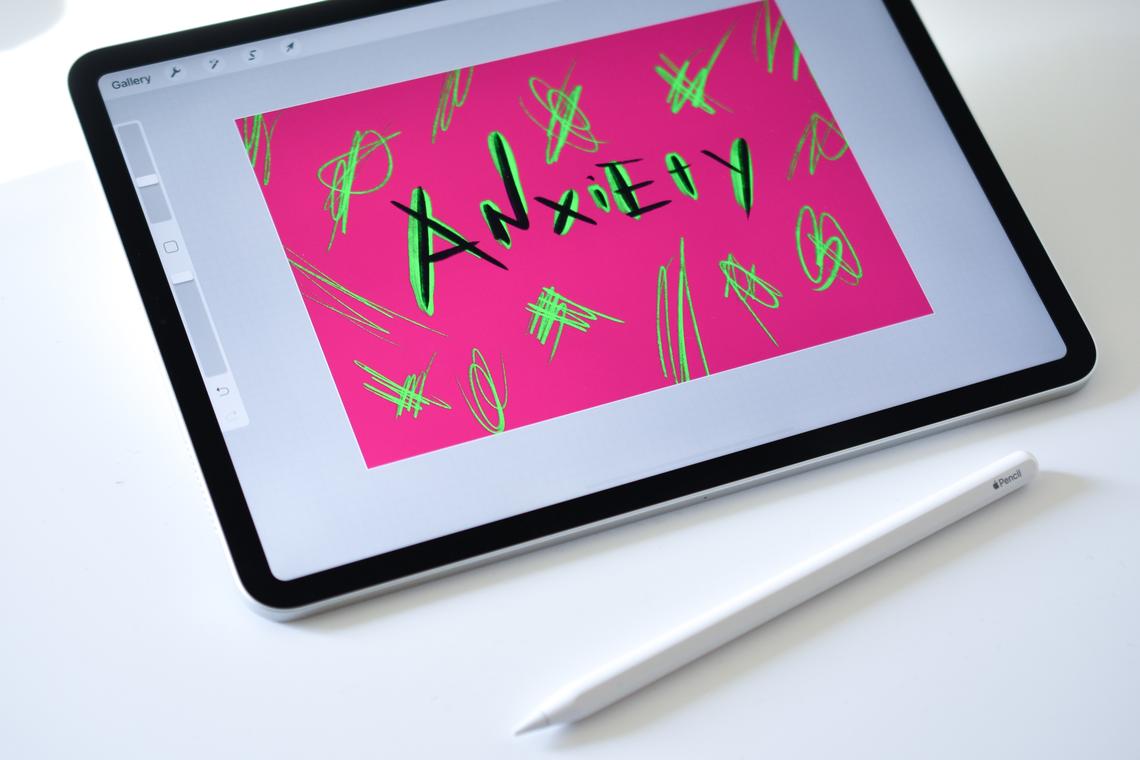 Tablet with "Anxiety" written on the screen in a colour design