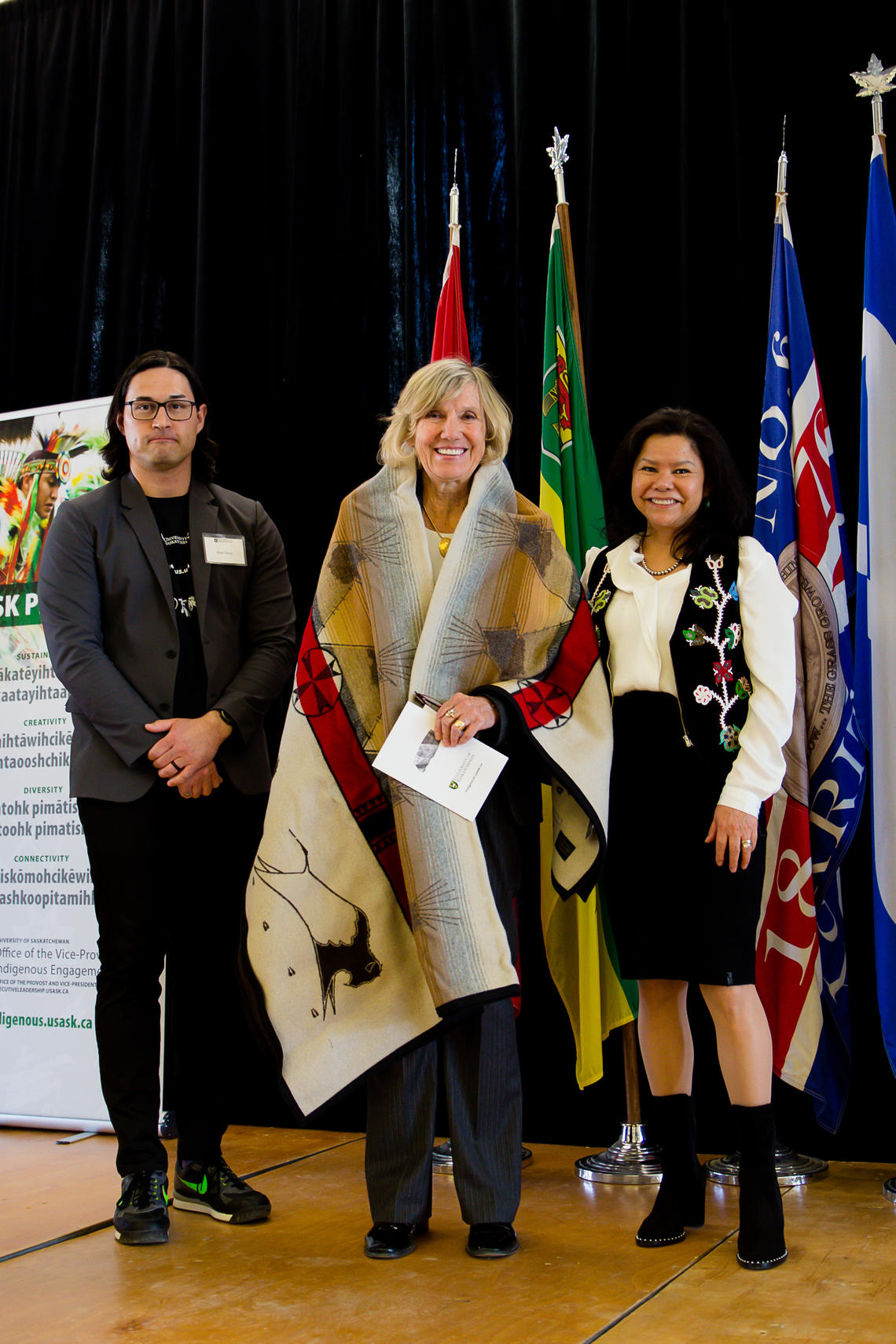 Kathleen Mahoney at the ceremony where she was gifted a blanket from the University of Saskatchewan