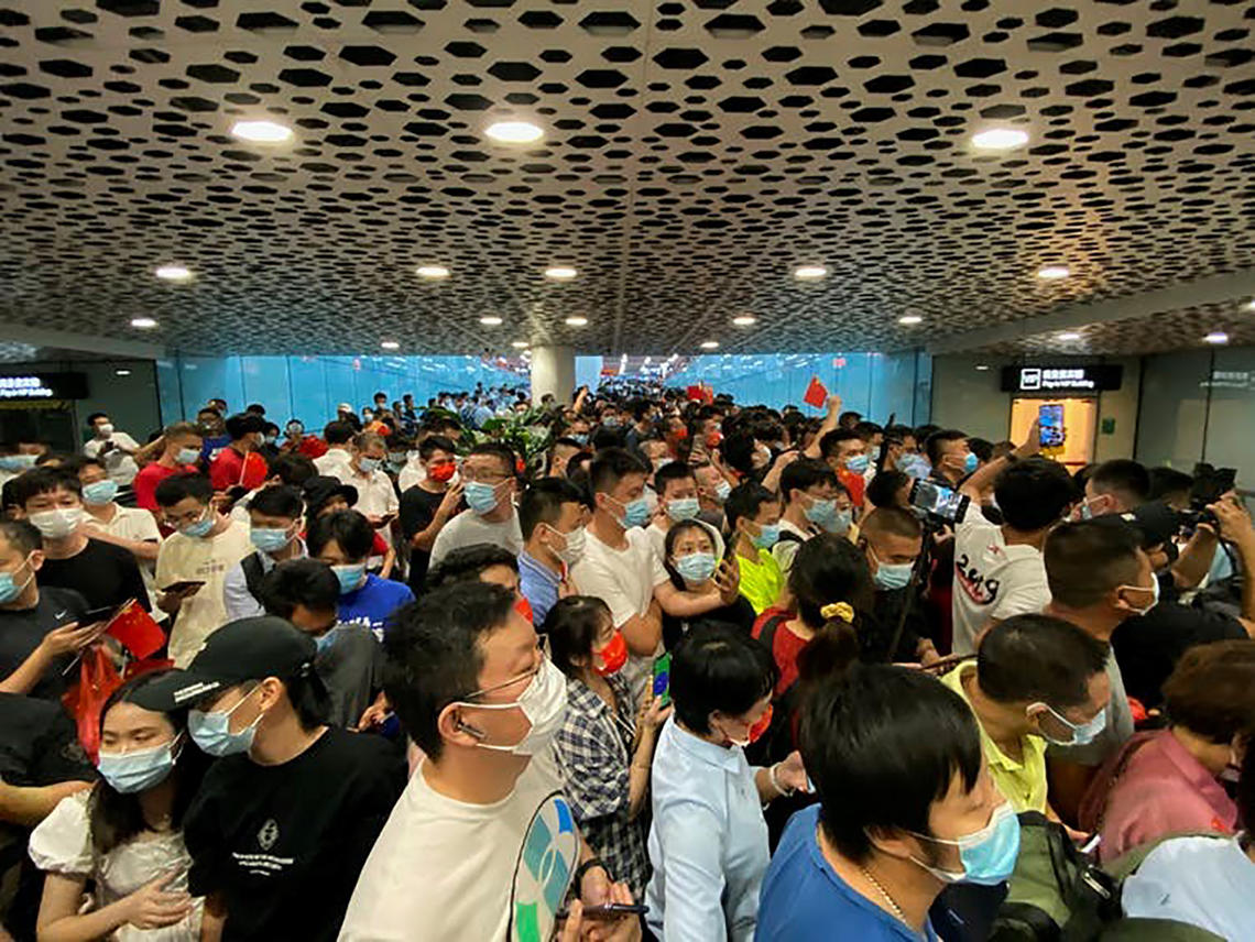 Supporters of Meng Wanzhou gather at Shenzhen Bao'an International Airport in China’s Guangdong Province to greet her 