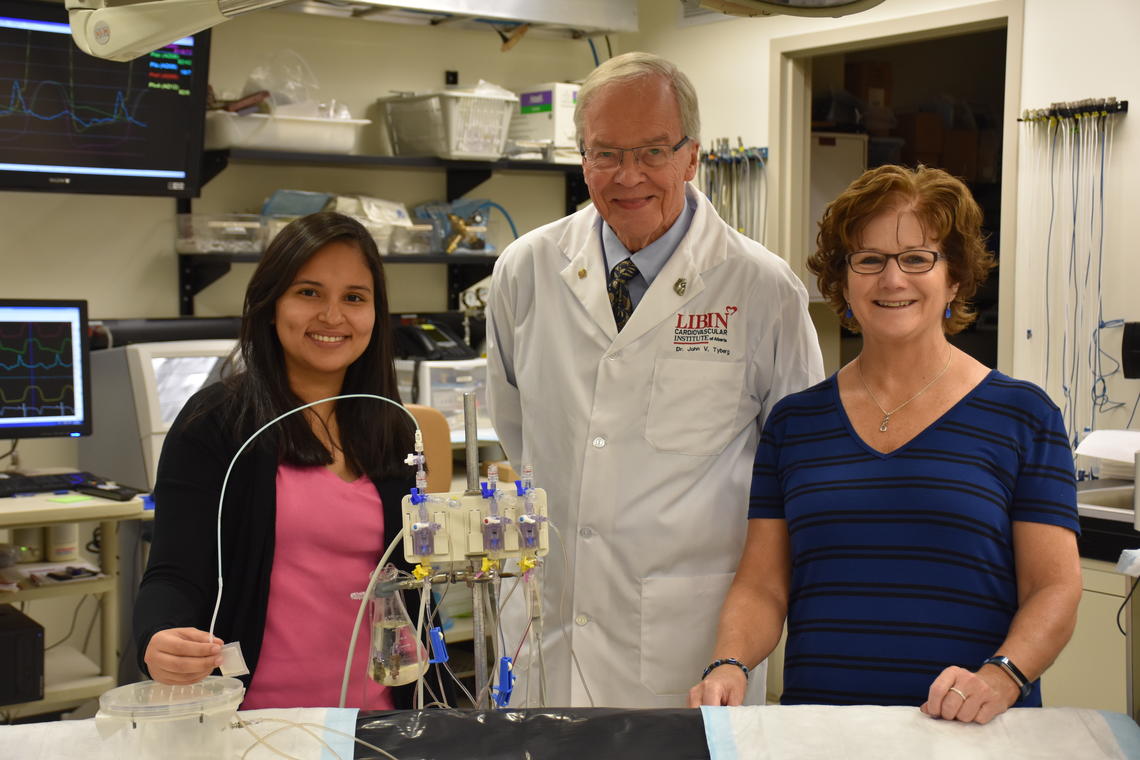 Dr. John Tyberg, MD, PhD, poses in his lab with trainee Dr. Maryell Urroz, MD, and his long-time lab manager and friend Cheryl Hall.