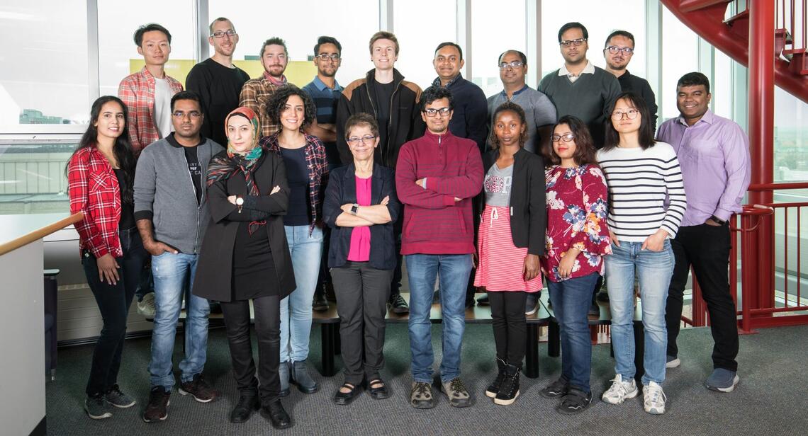 Rei Safavi-Naini (front row, fifth from left) with research colleagues and students