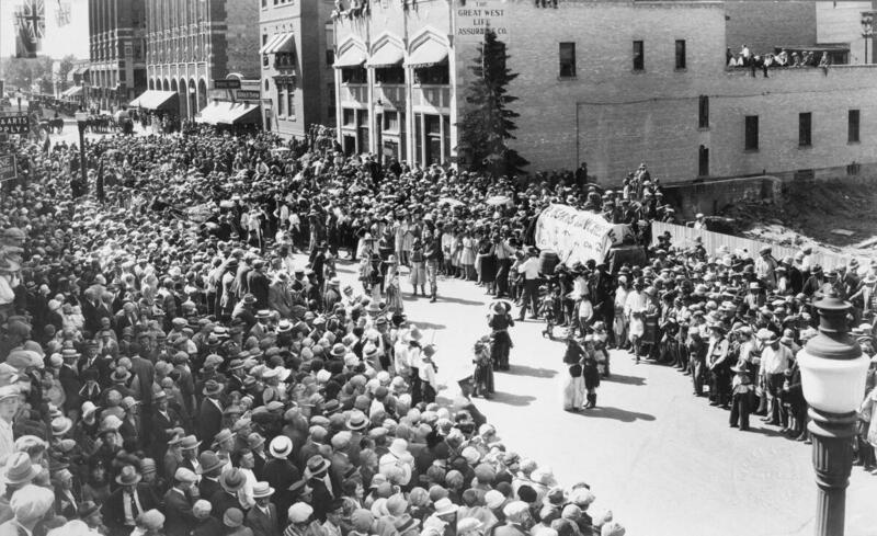 A Calgary Stampede downtown street dance on Seventh Avenue between First Street SW and Centre Street, during the filming of The Calgary Stampede in 1925.
