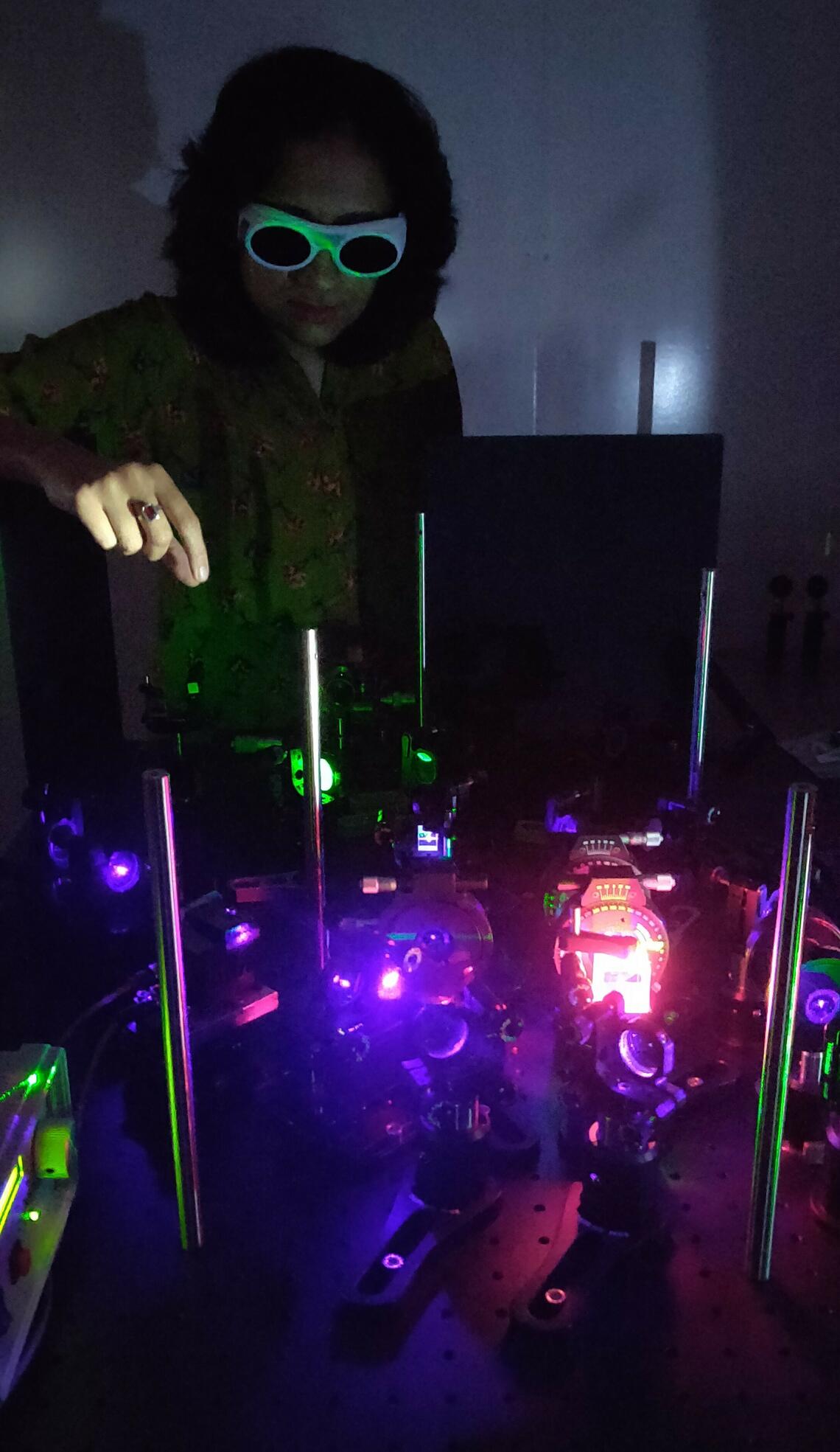 Urbasi Sinha working with quantum equipment in her lab in India