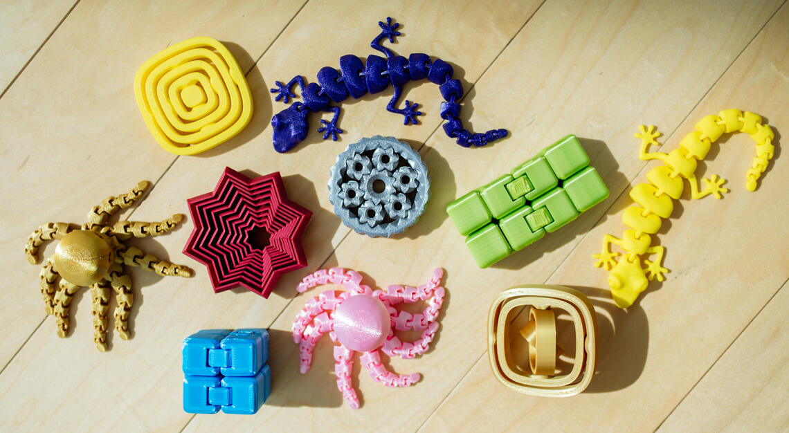 A group of multicoloured 3D printed sensory tools