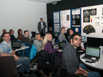 Participants in the SPM8 workshop, hosted by the NeuroLab in the university’s psychology department, explore advanced techniques for fMRI (functional magnetic resonance imaging) in the Visualization Studio. 2012. 