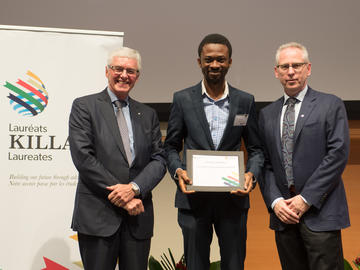 Killam Predoctoral Laureate Adedapo Awolayo, Chemical and Petroleum Engineering, with Killam Trustee Kevin Lynch (left) and Dr. Ed McCauley, vice-president (research)
