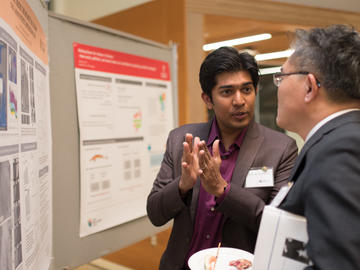 Killam Predoctoral Laureate and winner of the 2017 Byers Award Mallik Mahmud, Geography (left) discusses his work with Killam Visiting Scholar Dr. Steven Chien