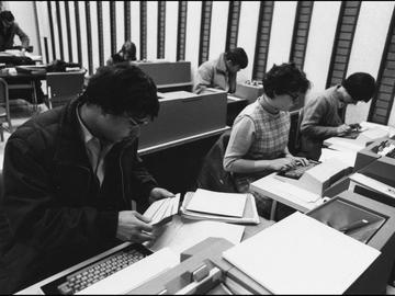 Students work with computer punch card machines in the MacKimmie Library. 1972. UARC011.01