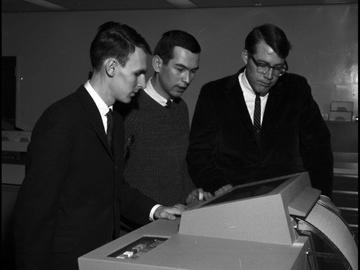 Three commerce students in the Faculty of Business play a computer game. 1967. UARC82.011.3.12