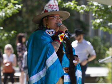 2022 First Nations Princess and UCalgary graduate student Sikapinakii Low Horn greets BBQ goers during the President's Stampede BBQ on July 12. 