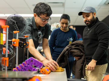 3d printing workshop participants looking at projects