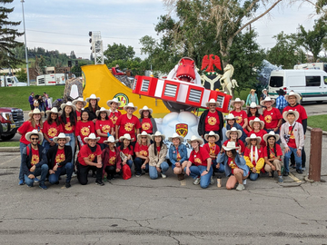 UCalgary Stampede Parade Volunteers and Staff with the parade float. 