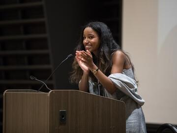 Misgana Abraha speaks during the ceremony