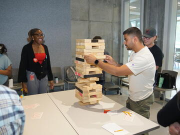 Students playing large Jenga