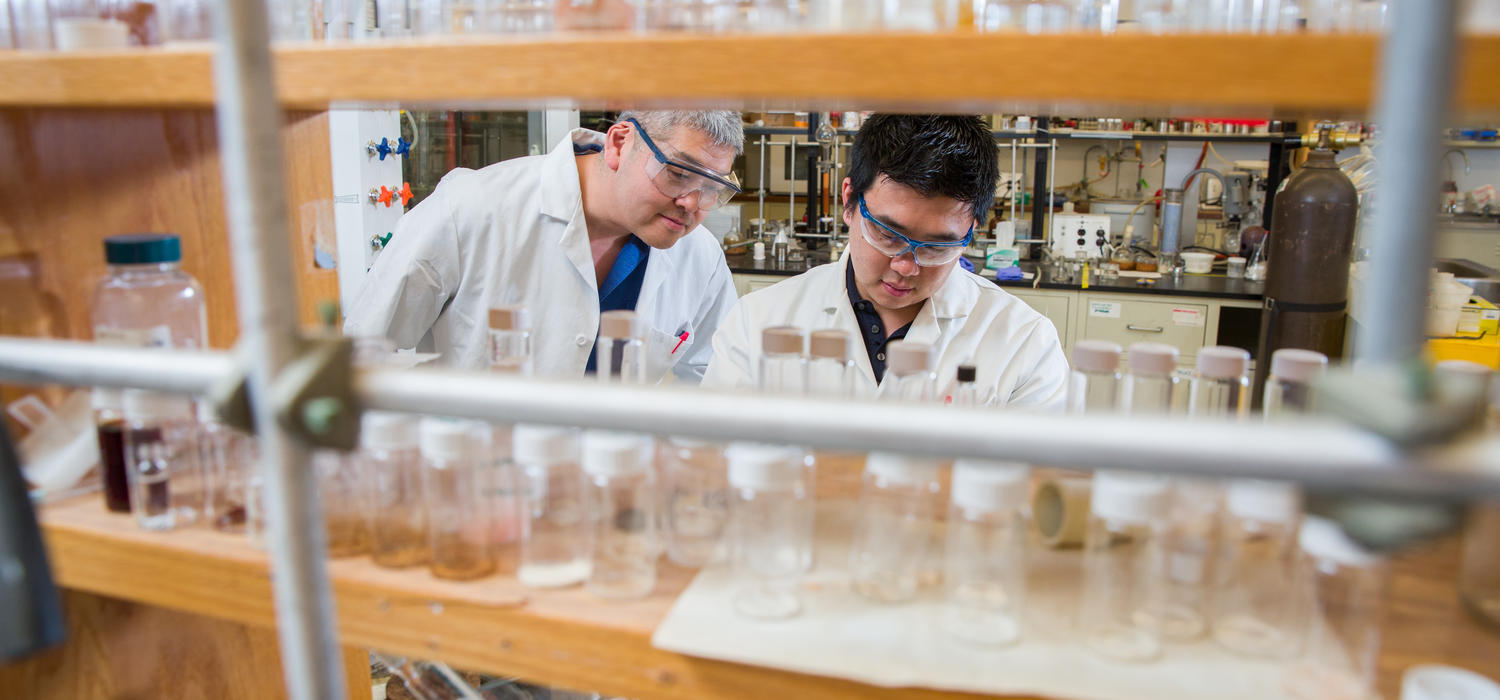 University of Calgary Chemistry professor George Shimizu, left, will lead the CREATE Training Program in Carbon Capture with the focus on training students such as grad student Roger Mah, right.
