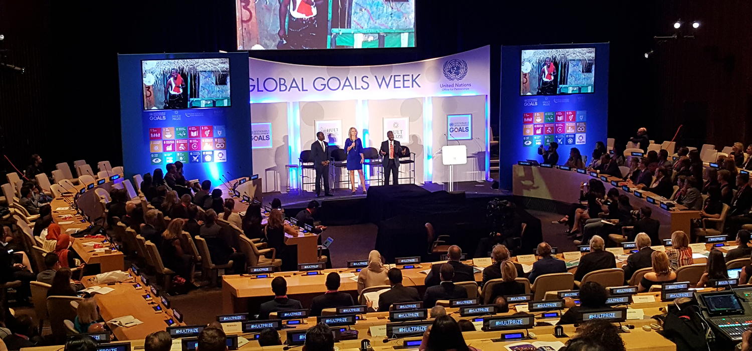 From left: William Akoto, Richelle Matthews, and Francis Duahn present onstage at the 2017 Hult Prize finals. Photo by Chris Wright