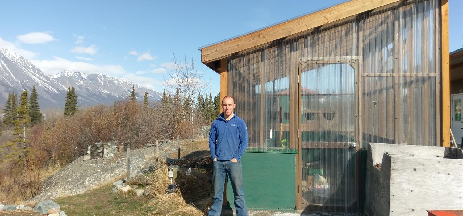 Henry Penn, a postdoctoral scholar with the University of Calgary-led Arctic Institute of North America, at the Kluane Lake Research Station where he is installing the Yukon’s first solar-powered Cropbox to try to grow fresh produce year-round. Photo by Robert Reich, Kluane Lake Research Station