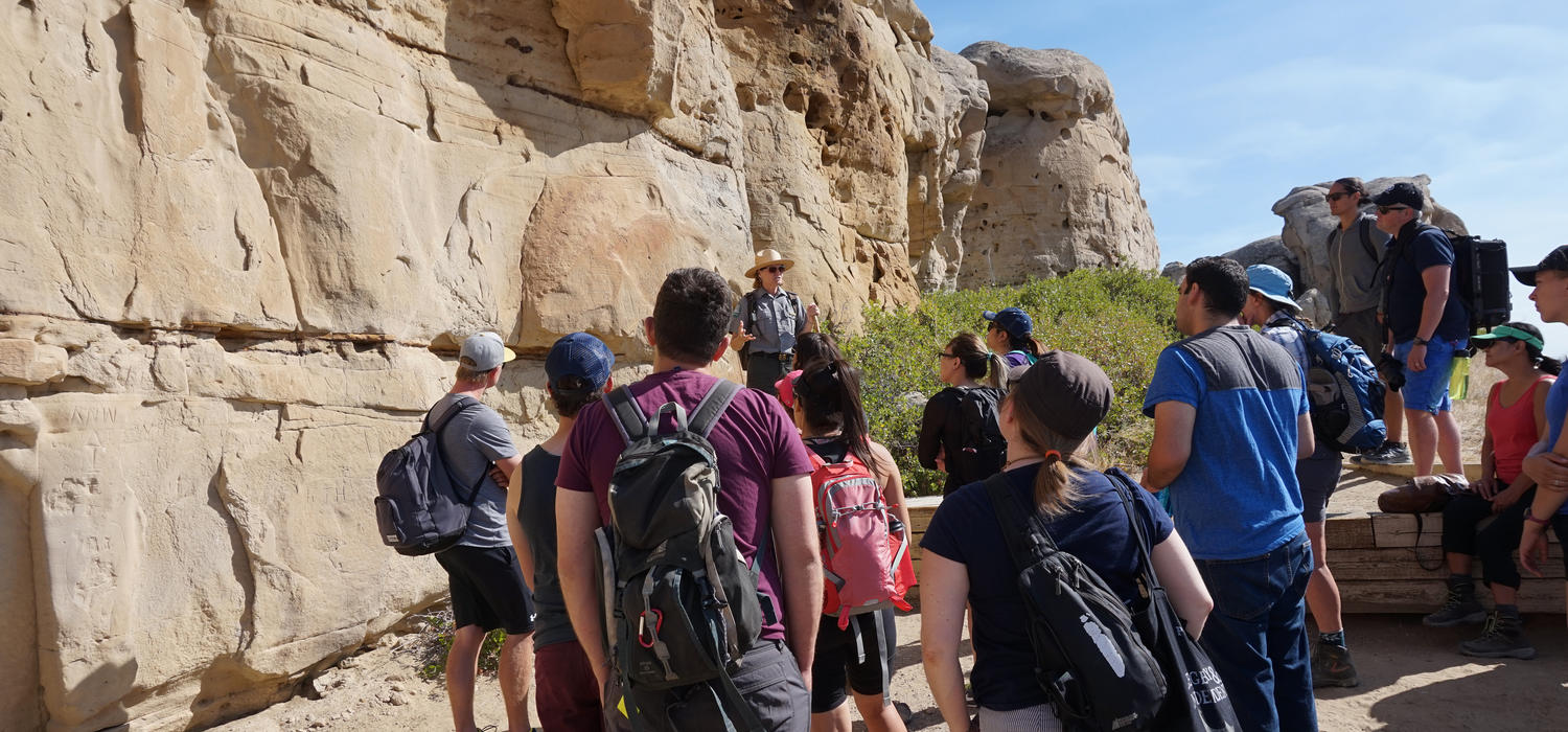 University of Calgary students get a lesson on the history of the petroglyphs at Writing-on-Stone Provincial Park, near Milk River, Alta. Photos by Trevor Alberts and Betty Rice, Werklund School of Education 