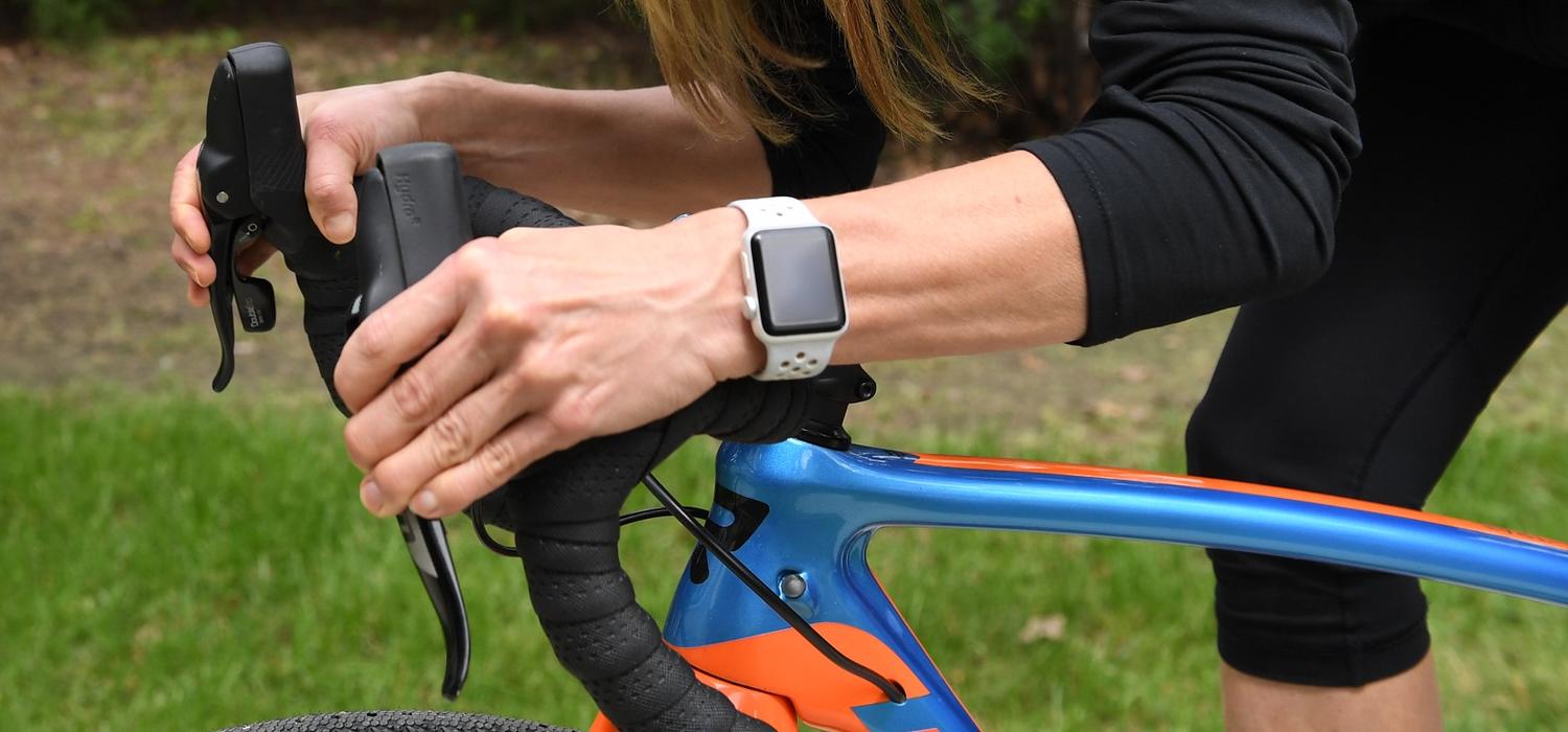 Cyclist riding while wearing a smart watch
