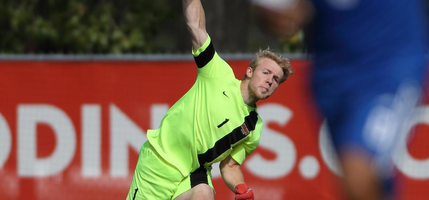 Soccer goaltender Jake Ruschkowski in action for the Dinos