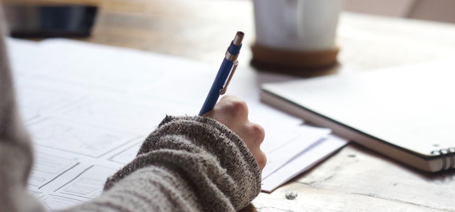 Stock photo of person writing