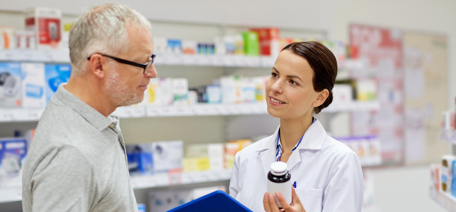 A pharmacist consults with a patient