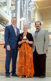 Valerie Pruegger, director of the Office of Diversity, Equity and Protected Disclosure, celebrates her Faculty of Arts Award with Dean Richard Sigurdson, left, and Michael Sclafani, associate vice-president, Alumni Engagement and Partnerships.