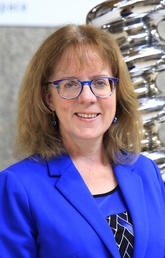 Janet Stein in front of the Zipper, the iconic sculpture that — years ago — was routinely and illicitly relocated by clever engineering students competing in an annual scavenger hunt. It was up to Stein and her team to arrange funding for its safe return to the Science Theatres.