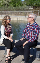 Kinga Olszewska, left, and David Phipps converse about knowledge mobilization during the Knowledge to Impact conference.