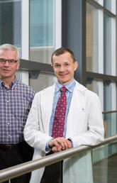 Peter Oxland, left, family advisor for critical care, and Dr. Tom Stelfox, University of Calgary associate professor of critical care medicine and an ICU physician, are collaborating to develop new measure of quality of care for critically ill and trauma patients. Their work is transforming how patients and family members are involved in improving critical care medicine across Alberta.