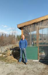 Henry Penn, a postdoctoral scholar with the University of Calgary-led Arctic Institute of North America, at the Kluane Lake Research Station where he is installing the Yukon’s first solar-powered Cropbox to try to grow fresh produce year-round. Photo by Robert Reich, Kluane Lake Research Station