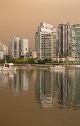 A smokey haze from wildfires burning in the region blankets Vancouver, B.C.