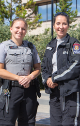 Campus security officers smile at camera