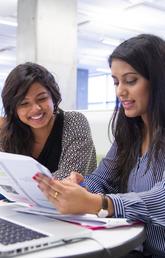 students looking at paper