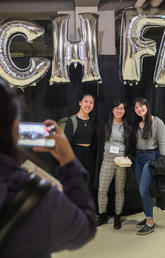 Students with Tech Fest display