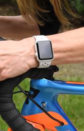 Cyclist riding while wearing a smart watch