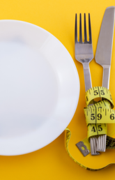 Empty plate with tape measure