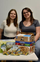 Grad students Jessica Wager (left) and Taylor Scheidl developed the Grad Snacks program to fight food insecurity in the grad student population at the Cumming School of Medicine