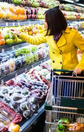 A lady grocery shopping