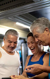 Three people exercising.