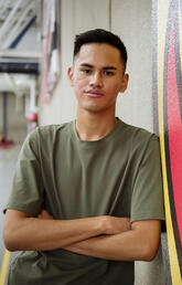 Nick Basilio leaning against a wall