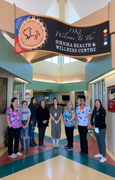 Siksika Health and Wellness Centre: From left - Jocelyn Duck Chief, laboratory technician, Logan Red Crow, patient, Kara Rabbit Carrier, MOA, Debbie Yellowfly, MOA, Dr. Jori Hardin, Margaret Kargard, Clinical Services Team Leader, Susan Maguire, LPN, Jamie Yellowfly, MOA,
