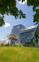 A glass building on a college campus