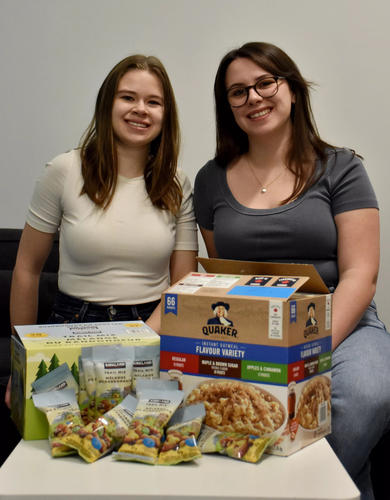 Grad students Jessica Wager (left) and Taylor Scheidl developed the Grad Snacks program to fight food insecurity in the grad student population at the Cumming School of Medicine