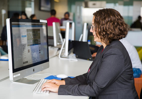 A person works on the computer.