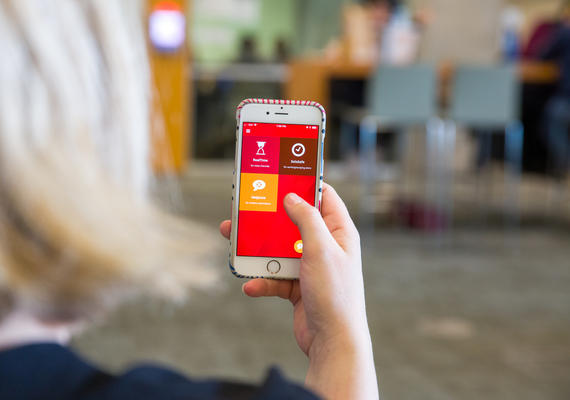 A phone displaying the UC Emergency Mobile App