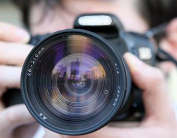 Person taking a picture, close up of the camera 