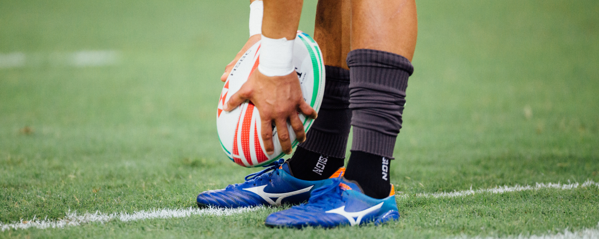 Rugby player placing ball on ground