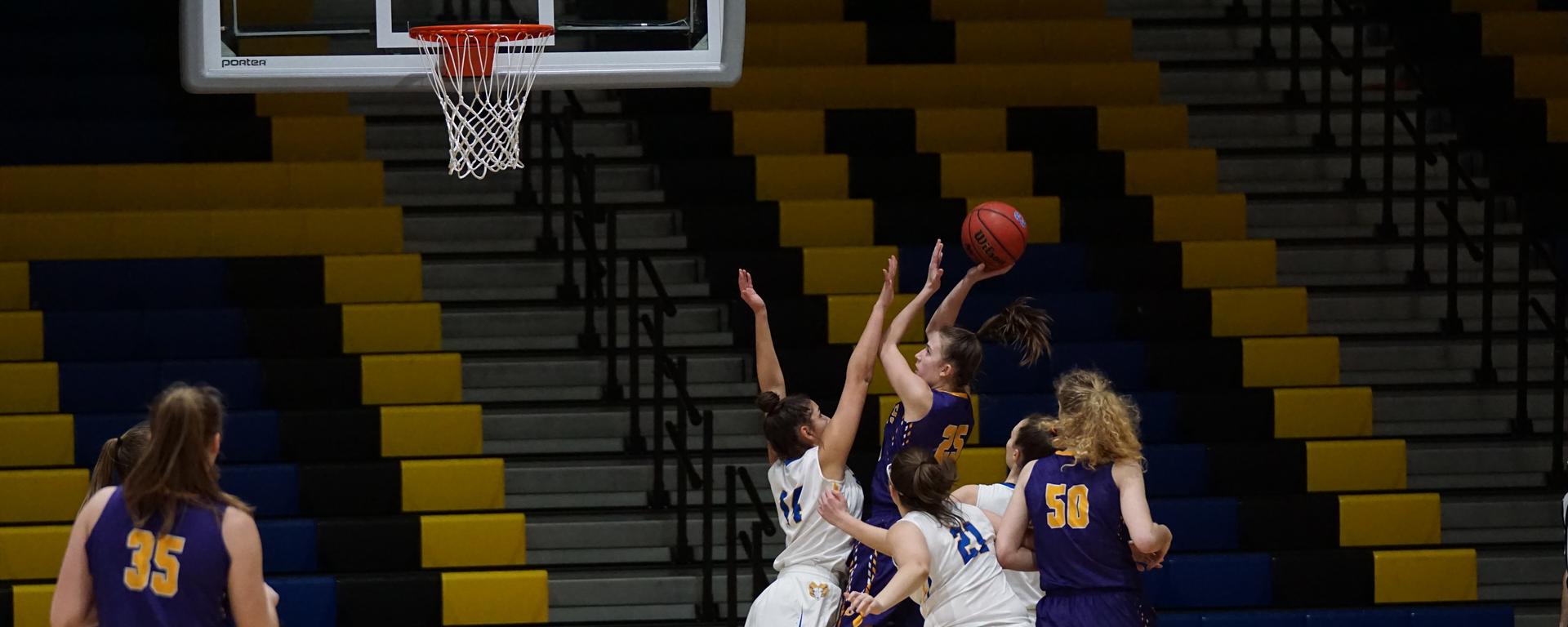 High school basketball players shooting a basketball