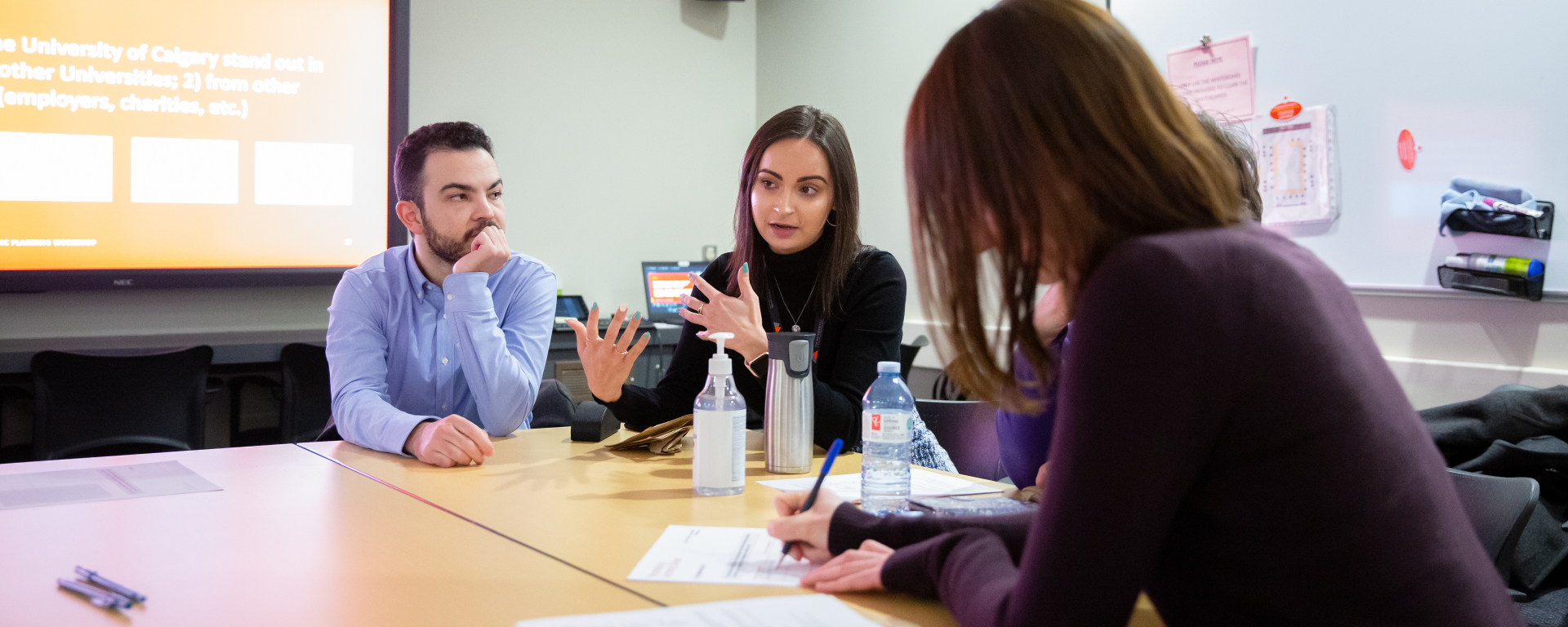 Group of people gathered at a table during one of the strategic planning workshops in February.